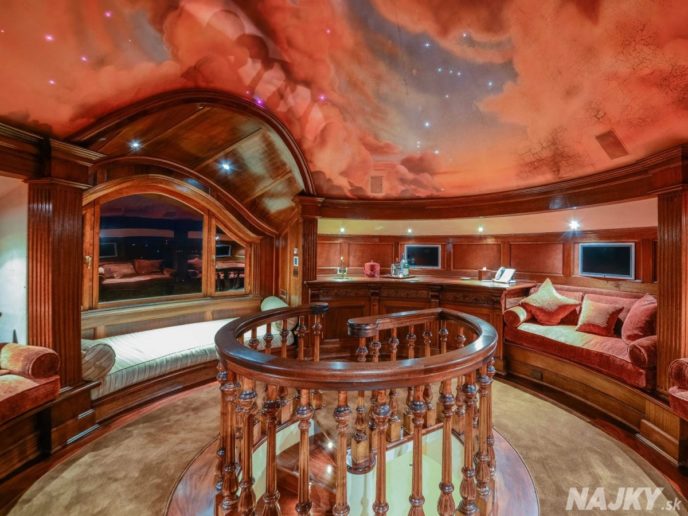 at-the-very-top-of-the-house-is-this-round-reading-room-with-a-painted-ceiling