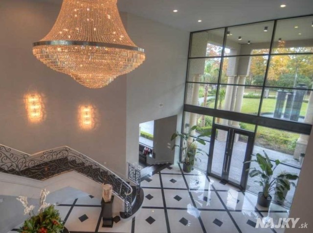 guests-are-immediately-greeted-by-a-towering-entryway-complete-with-a-swarovski-crystal-chandelier