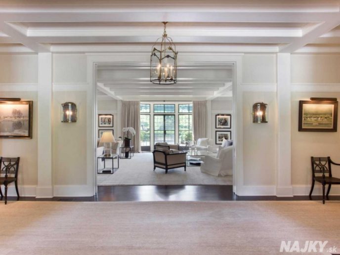 the-entryway-leads-into-the-formal-living-room-with-leaded-glass-doors-overlooking-the-manicured-back-lawn