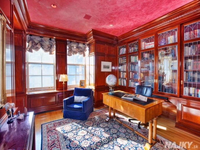 the-library-still-retains-the-classic-old-world-feel-with-custom-wood-cabinetry-and-a-venetian-plaster-ceiling
