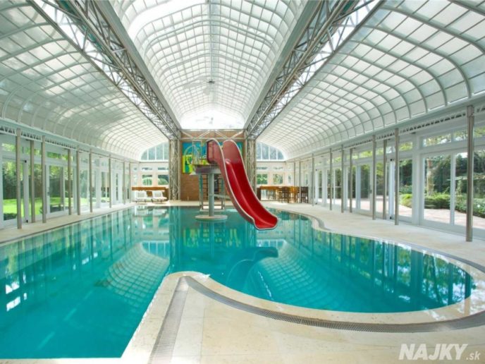 the-most-unique-feature-of-the-home-is-the-water-slide-plunging-into-the-indoor-pool