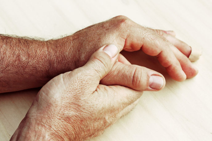 Elderly man has pain in fingers and hands