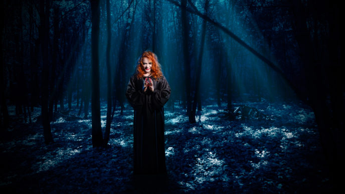 Witch in night forest