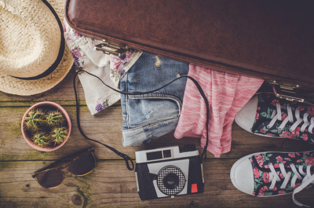 Travel preparations on wooden table