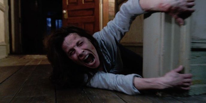 A terrified lili taylor in the conjuring.jpg