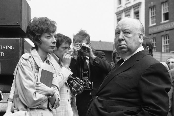 FILE - In this July 26, 1971 file photo, British film producer and director Alfred Hitchcock, right, discusses filming with actress Anna Massey, one of the stars of "Frenzy", in Covent Garden Market, London. Massey, an acting dynasty member whose roles ranged from lonely spinsters to Margaret Thatcher, has died at 73. Massey's agent, Pippa Markham, says she died Saturday, JUly 2, 2011, after a battle with cancer. (AP Photo/Leonard Brown, file)