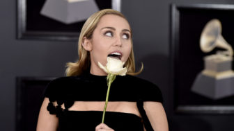 Miley Cyrus holds a white rose as she arrives at the 60th annual Grammy Awards at Madison Square Garden on Sunday, Jan. 28, 2018, in New York. (Photo by Evan Agostini/Invision/AP)
