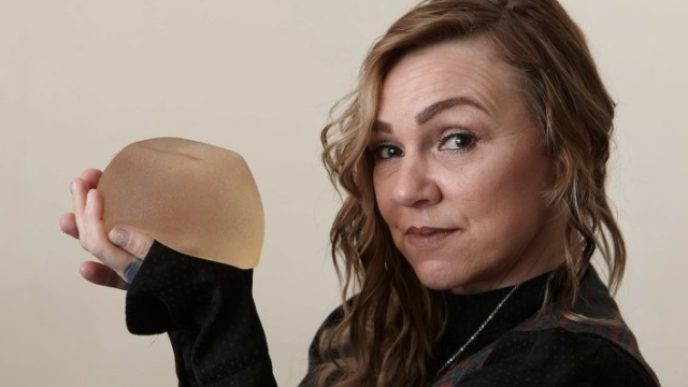 MUM REMOVES HER OWN BREAST IMPLANT