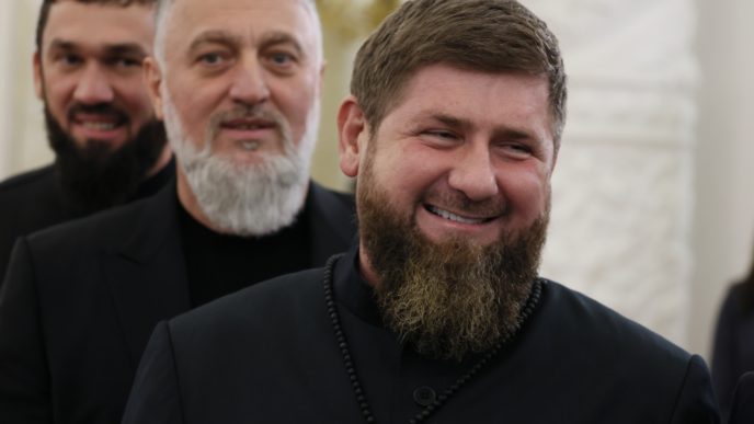 Chechnya's regional leader Ramzan Kadyrov, foreground, deputy of the State Duma of the Russian Federation Adam Delimkhanov, center, and Chairman of the Parliament of the Chechen Republic Magomed Daudov arrive to attend a ceremony to sign the treaties for four regions of Ukraine to join Russia in the Kremlin in Moscow, Russia, Friday, Sept. 30, 2022. The signing of the treaties making the four regions part of Russia follows the completion of the Kremlin-orchestrated "referendums."