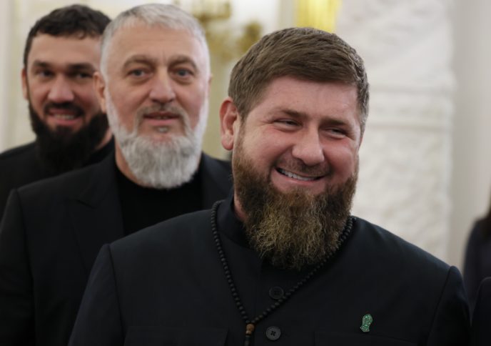 Chechnya's regional leader Ramzan Kadyrov, foreground, deputy of the State Duma of the Russian Federation Adam Delimkhanov, center, and Chairman of the Parliament of the Chechen Republic Magomed Daudov arrive to attend a ceremony to sign the treaties for four regions of Ukraine to join Russia in the Kremlin in Moscow, Russia, Friday, Sept. 30, 2022. The signing of the treaties making the four regions part of Russia follows the completion of the Kremlin-orchestrated "referendums."