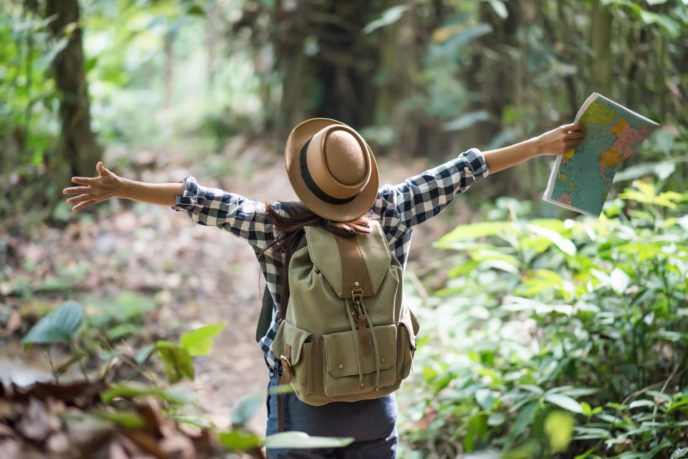 Young women people Hiking with friends backpacks walking togeth