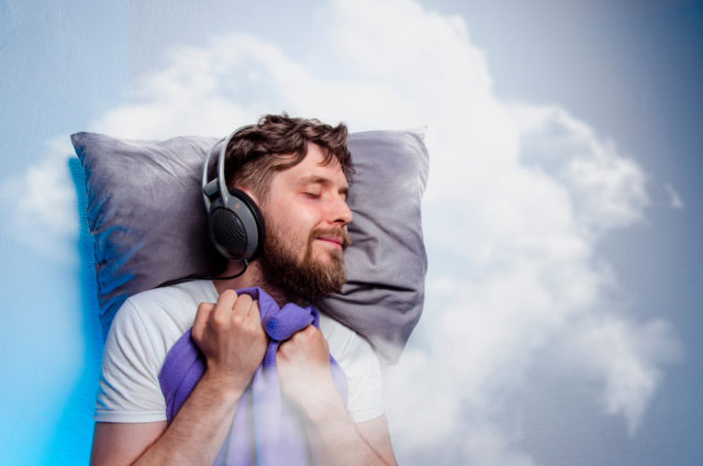 Man,With,Headphones,,Sound,Asleep,,Sleeping,In,Clouds