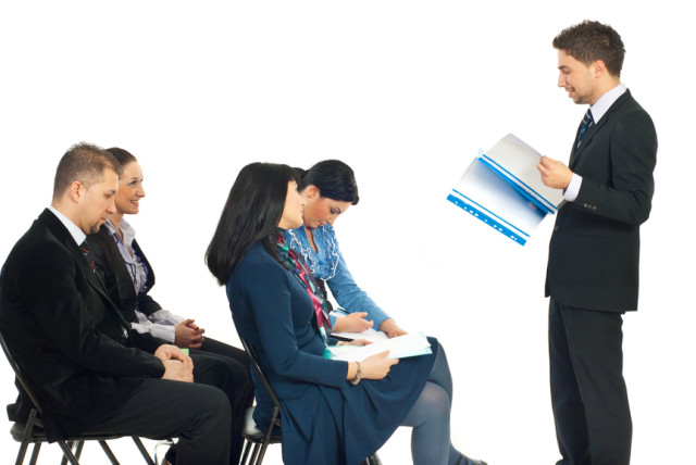 Four busienss people at conference being bored by a colleague man speech isolated on white background