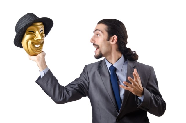 Businessman with mask concealing his identity