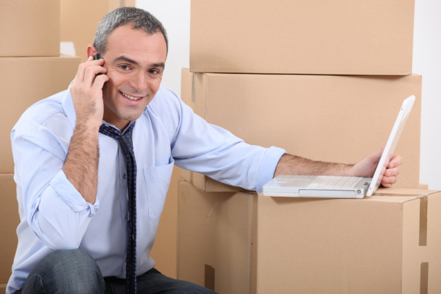 portrait of a man with moving boxes