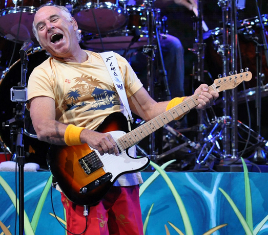 In this Saturday, July 28, 2012 photo, Jimmy Buffett performs in his first-ever concert in the city of Detroit. (AP Photo/Detroit News, Adam Graham)