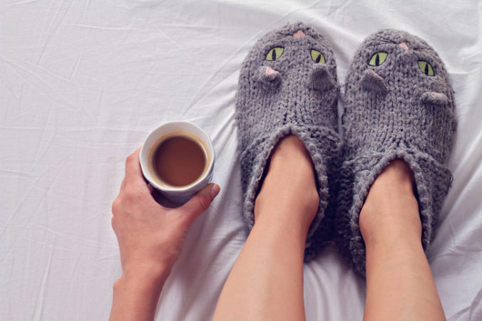 Woman wearing cozy warm wool socks close up.