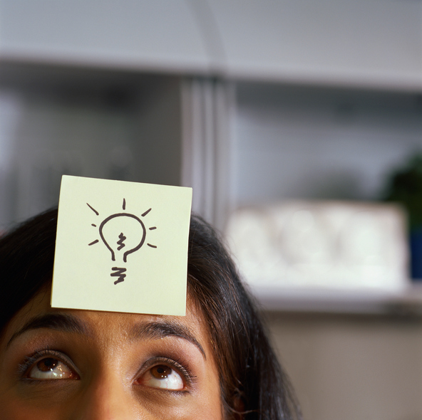 Woman with light bulb above head