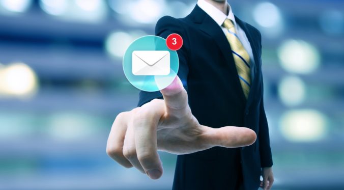 Businessman pointing at an email icon