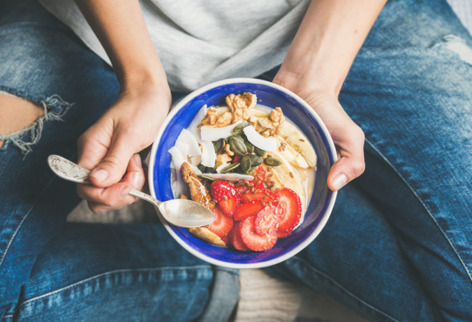 Yogurt, granola, seeds, fresh, dry fruits and honey in bowl