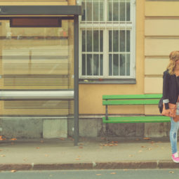 Girl waiting for a bus.