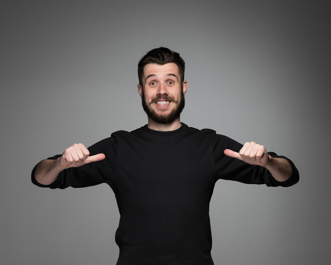 Young man pointing himself