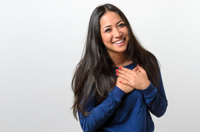 Young woman showing her heartfelt gratitude