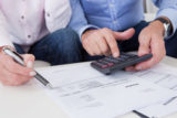 Close up of couple doing finances at home
