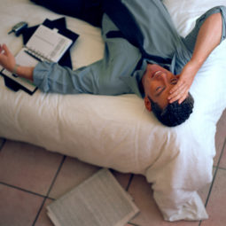 Businessman relaxing on bed