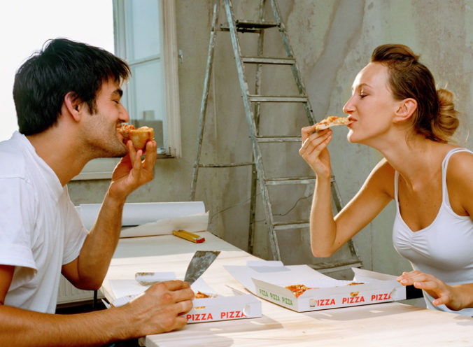 Couple eating pizza