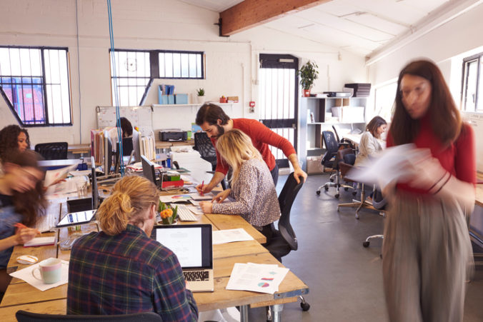 Interior Of Busy Design Office With Staff