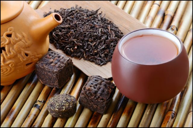 Chinese black pu erh tea and tea leaves.jpg