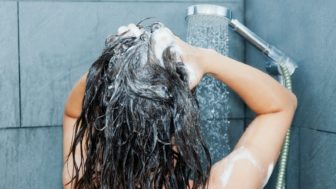 Woman is washing her hair