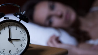 Alarm clock on night table