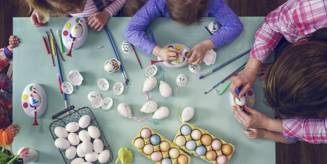 Kids painting easter eggs royalty free image 645980914 1551798969.jpg
