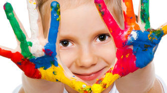 Little girl child painted hands handprints paint.jpeg