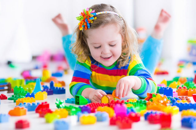 Girl playing with colorful blocks.jpg