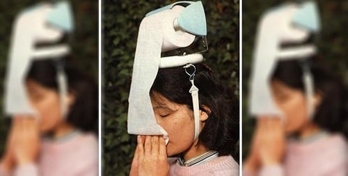 Head mounted toilet paper dispenser.jpg