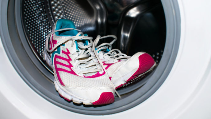 Shoe washing. White and pink sneakers wash in the washer (automatic washing machine). How to clean sneakers