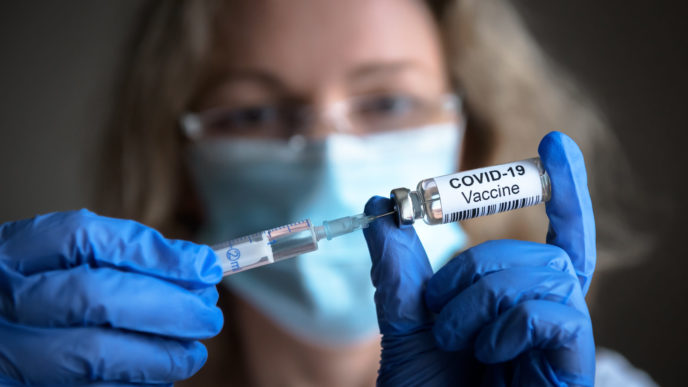 COVID 19 coronavirus vaccine in doctor hands