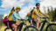 Family with small children cycling outdoors in summer nature, High Tatras in Slovakia.
