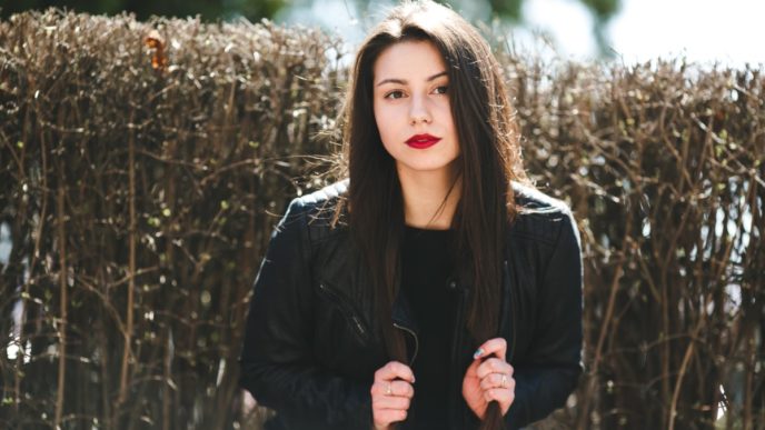 Glamorous young woman in black leather jacket