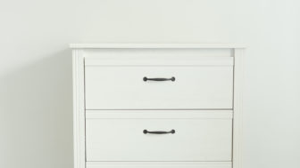 White modern chest drawers near white wall.jpg