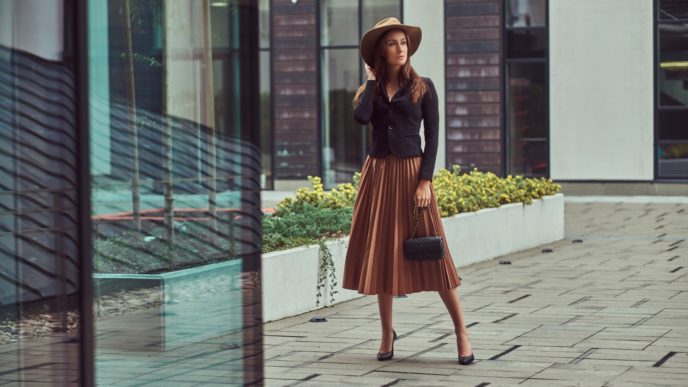 Fashion elegant woman walking on the European city center.