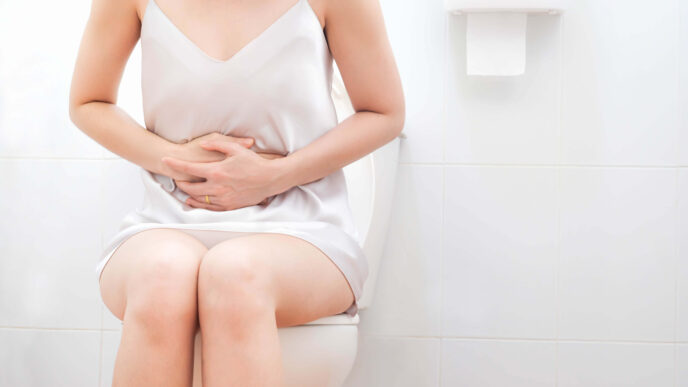 žena sedí na záchode