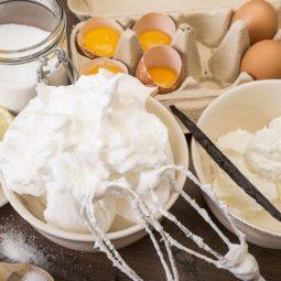 Bowl of beaten egg white and other baking ingredients of meringues on wooden table 499164753 58236dc45f9b58d5b1f31c74.jpg