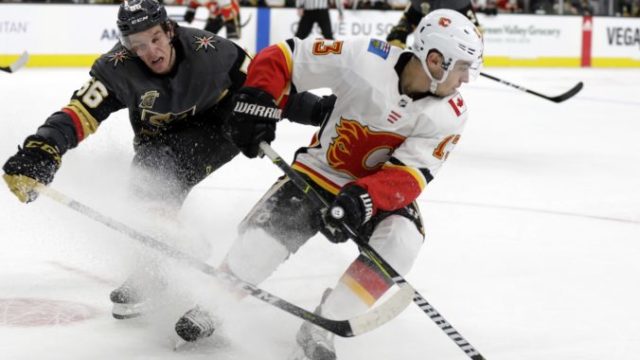 368240_johnny gaudreau erik haula 676x505.jpg