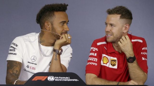 370700_lewis hamilton sebastian vettel 676x401.jpg