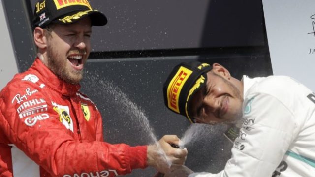 382289_sebastian vettel lewis hamilton 676x463.jpg