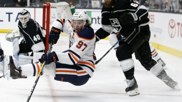 394230_connor mcdavid jake muzzin 676x507.jpg